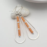 Harley - Silver & Orange Earrings Bijou by SAM   