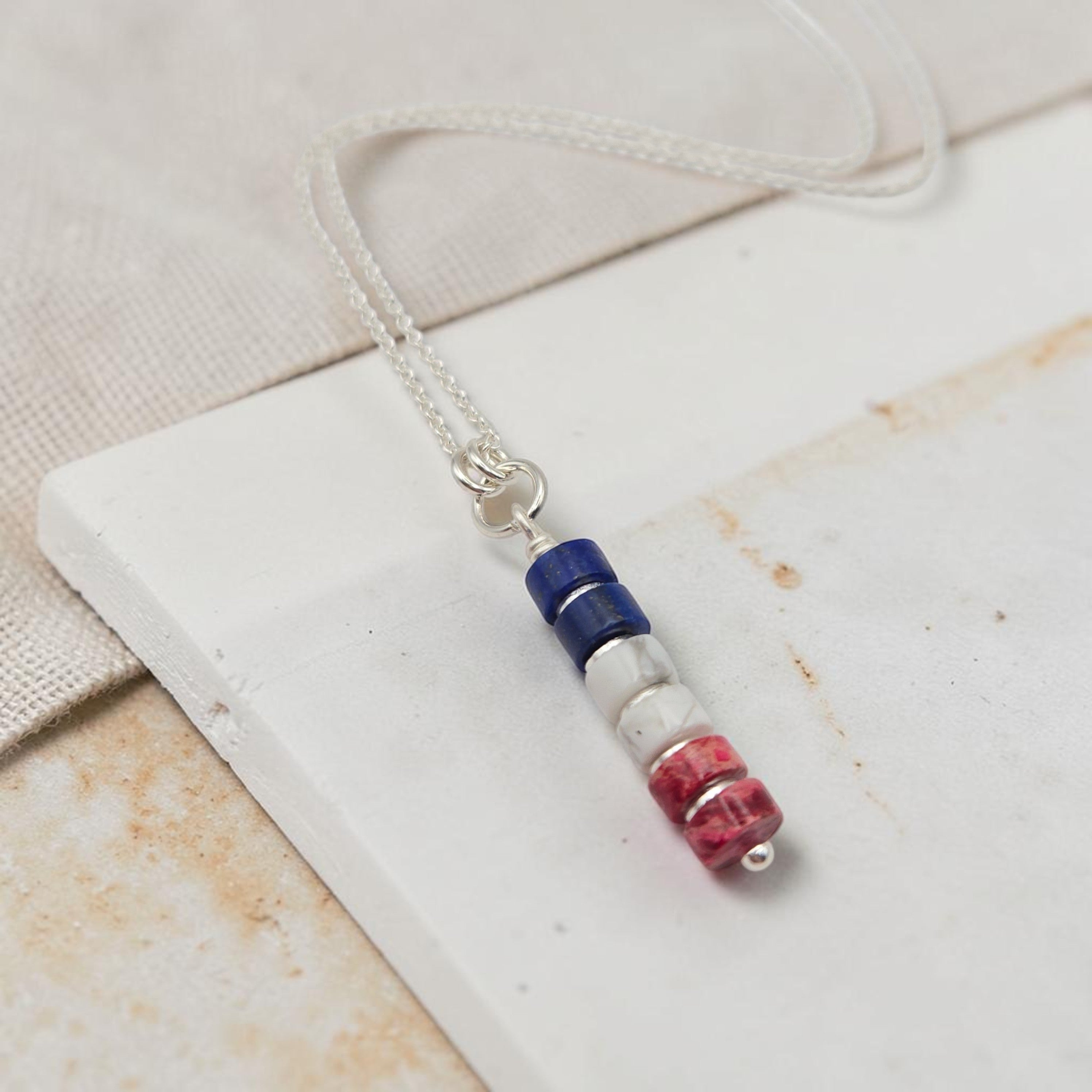 Necklace with colorful beads on a white surface