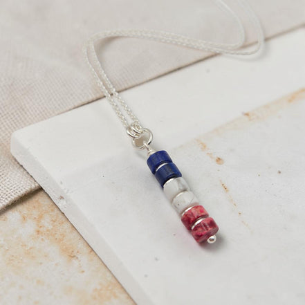 Necklace with colorful beads on a white surface