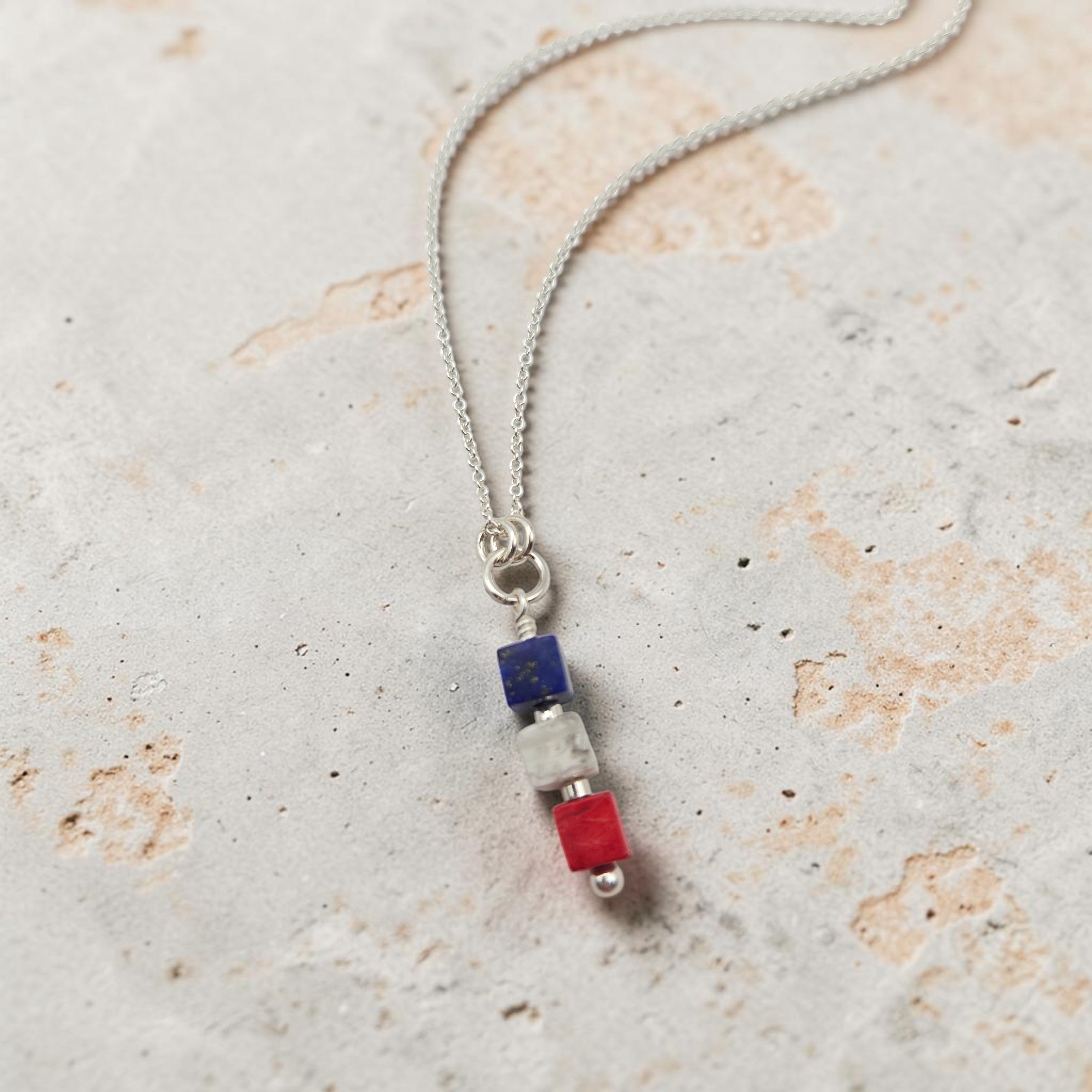 Necklace with colorful beads on a textured surface
