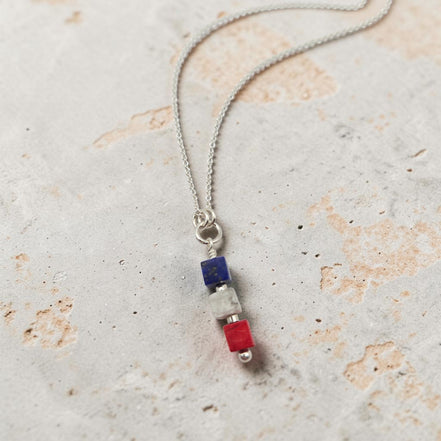 Necklace with colorful beads on a textured surface