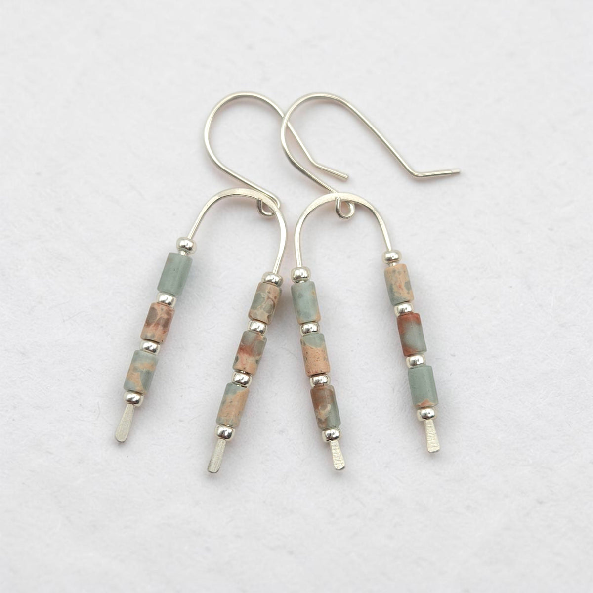 silver wishbone earrings with blue and tan aqua terra jasper gemstone beads