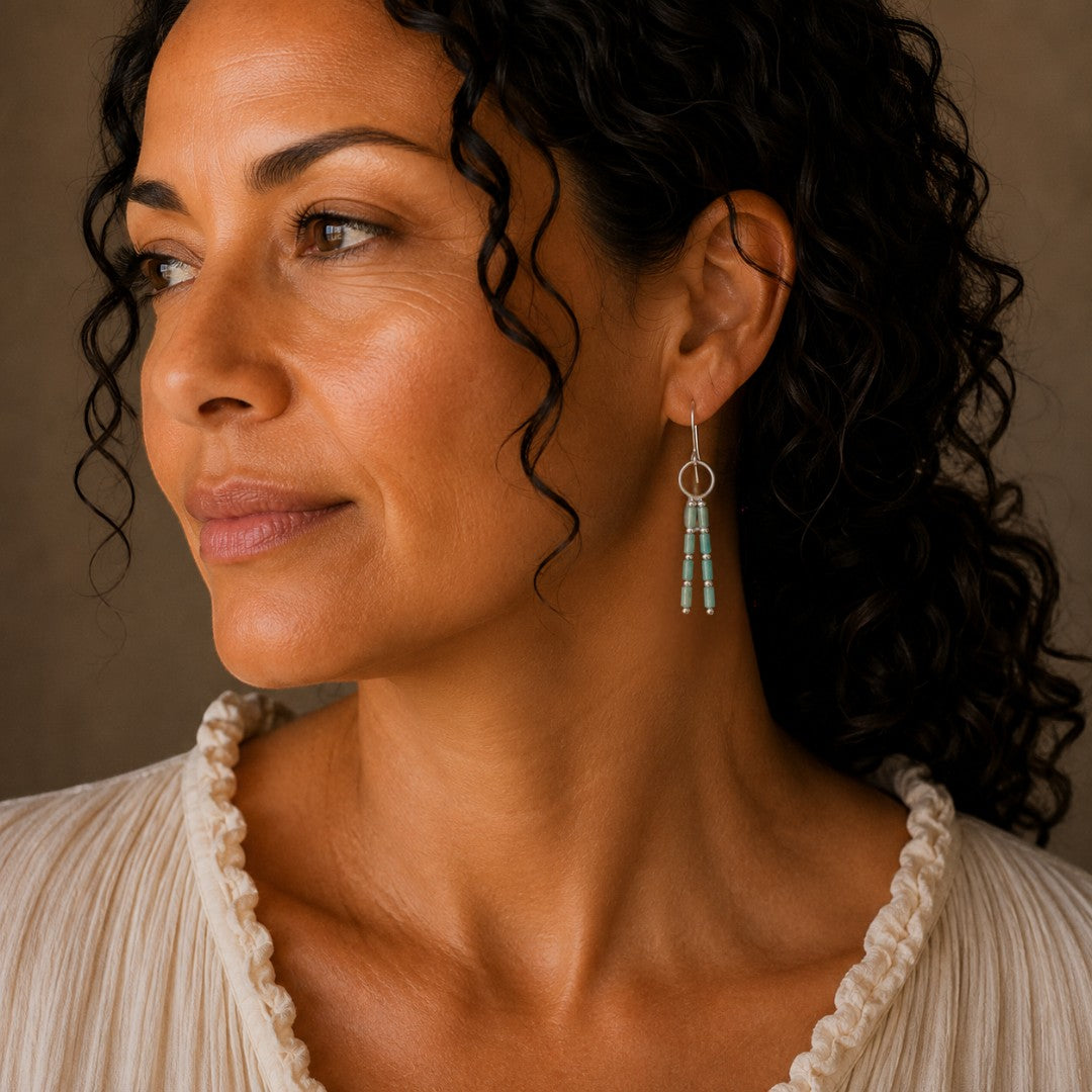 Bijou by SAM River Stone dangle earrings featuring Amazonite tube beads and silver hoops worn by a woman.