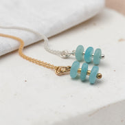Bijou by SAM Northern Lights necklace featuring aqua-green amazonite stones on gold fill and sterling silver chains.