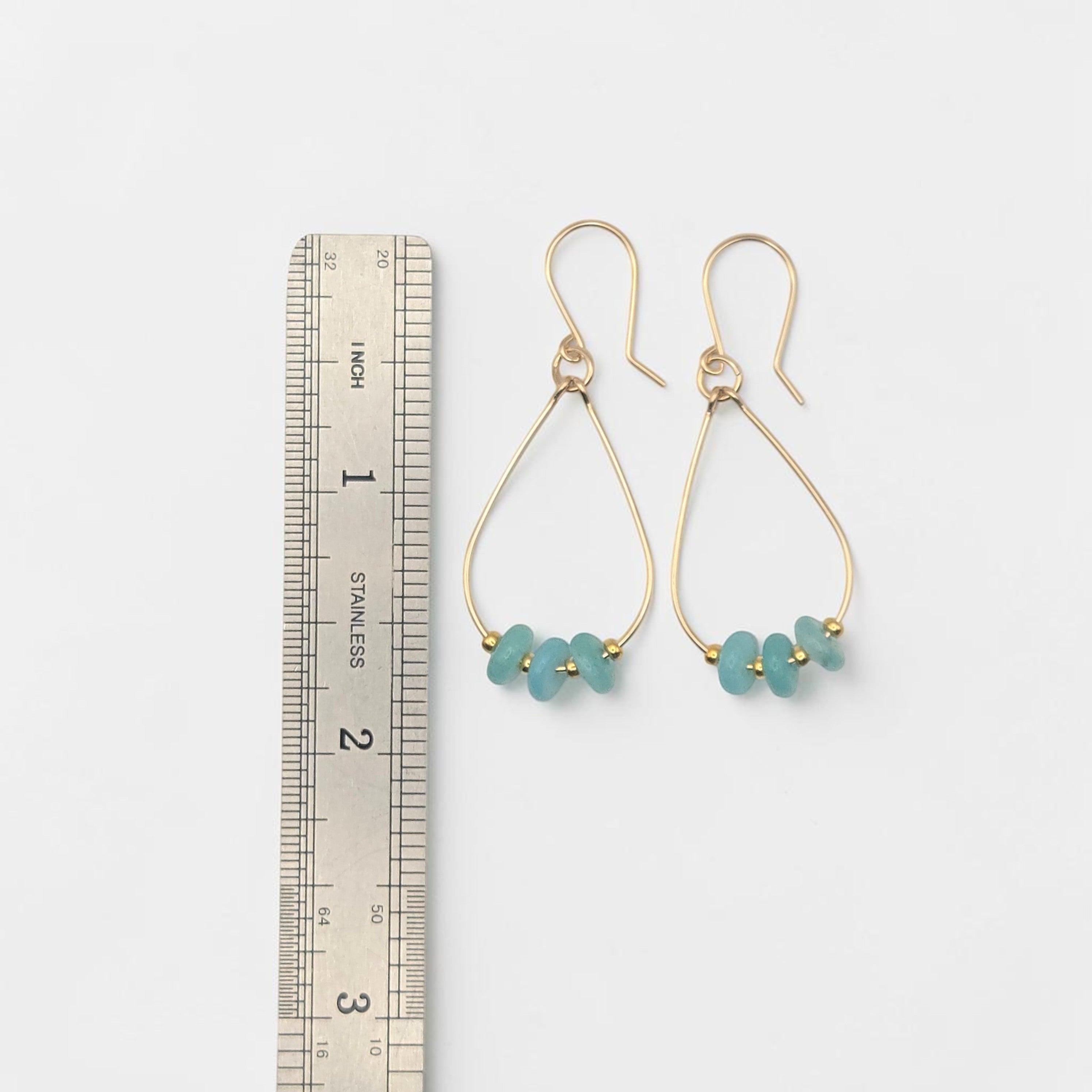Bijou by SAM Northern Lights teardrop hoop earrings featuring aqua-green amazonite stones on 14k gold fill wire.