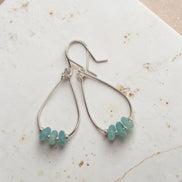 Bijou by SAM Northern Lights teardrop hoop earrings featuring aqua-green amazonite stones on sterling silver wires.