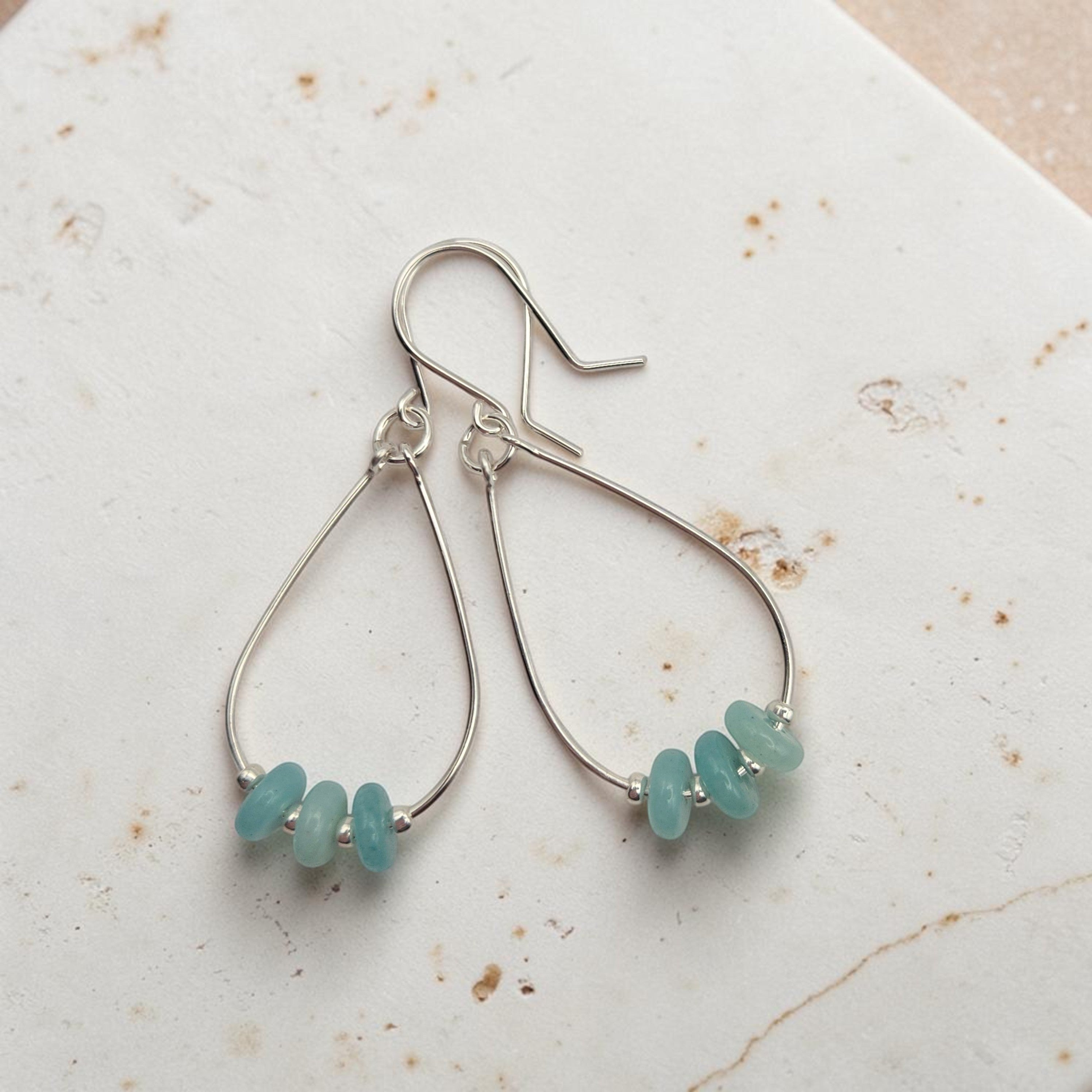 Bijou by SAM Northern Lights teardrop hoop earrings featuring aqua-green amazonite stones on sterling silver wires.