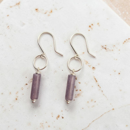 Bijou by SAM Sophia earrings featuring purple amethyst cylinder stones on handcrafted sterling silver hoops.