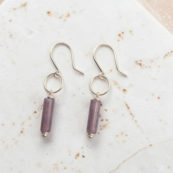 Bijou by SAM Sophia earrings featuring purple amethyst cylinder stones on handcrafted sterling silver hoops.