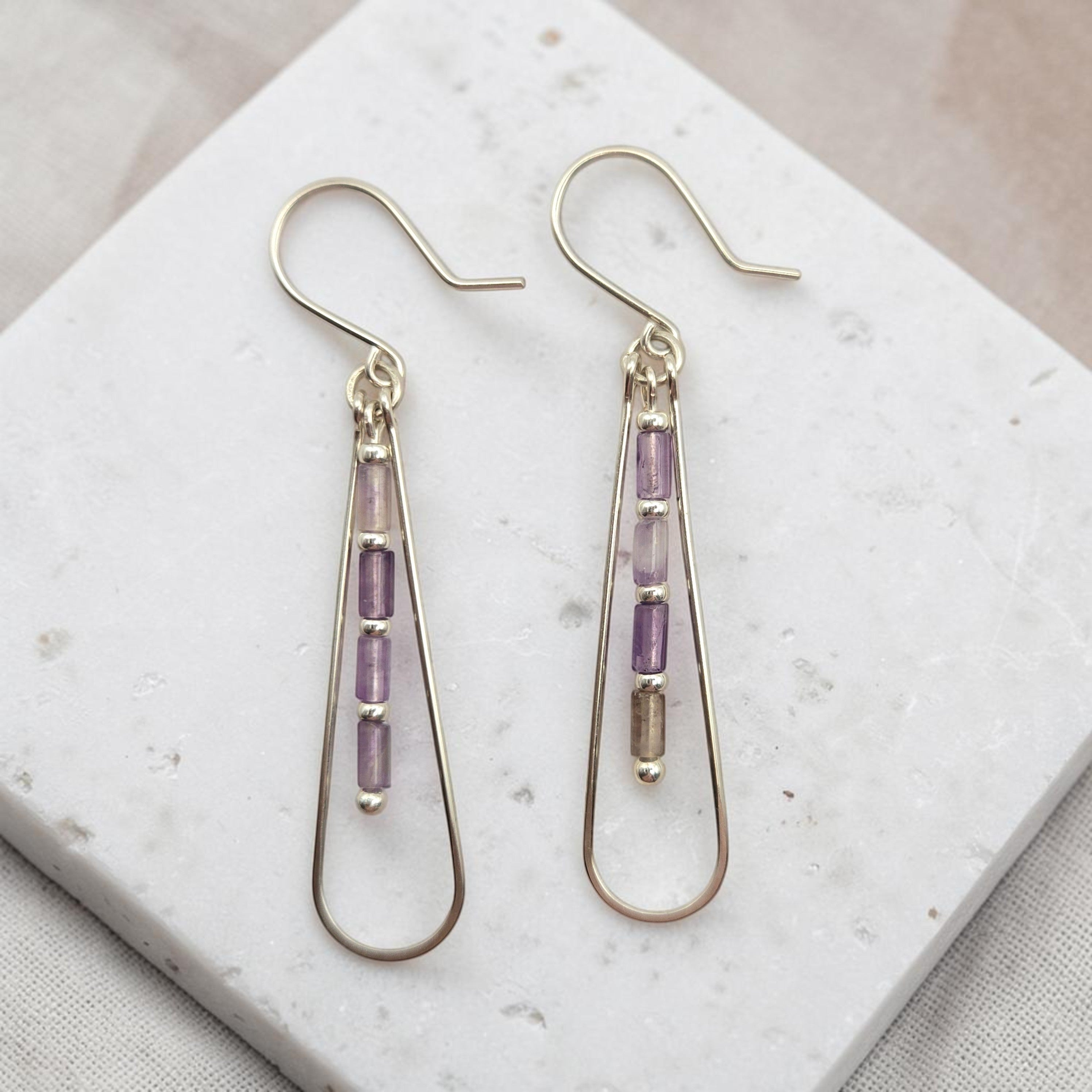 Bijou by SAM Twilight Ridge teardrop earrings featuring purple amethyst tube beads on silver hoops.