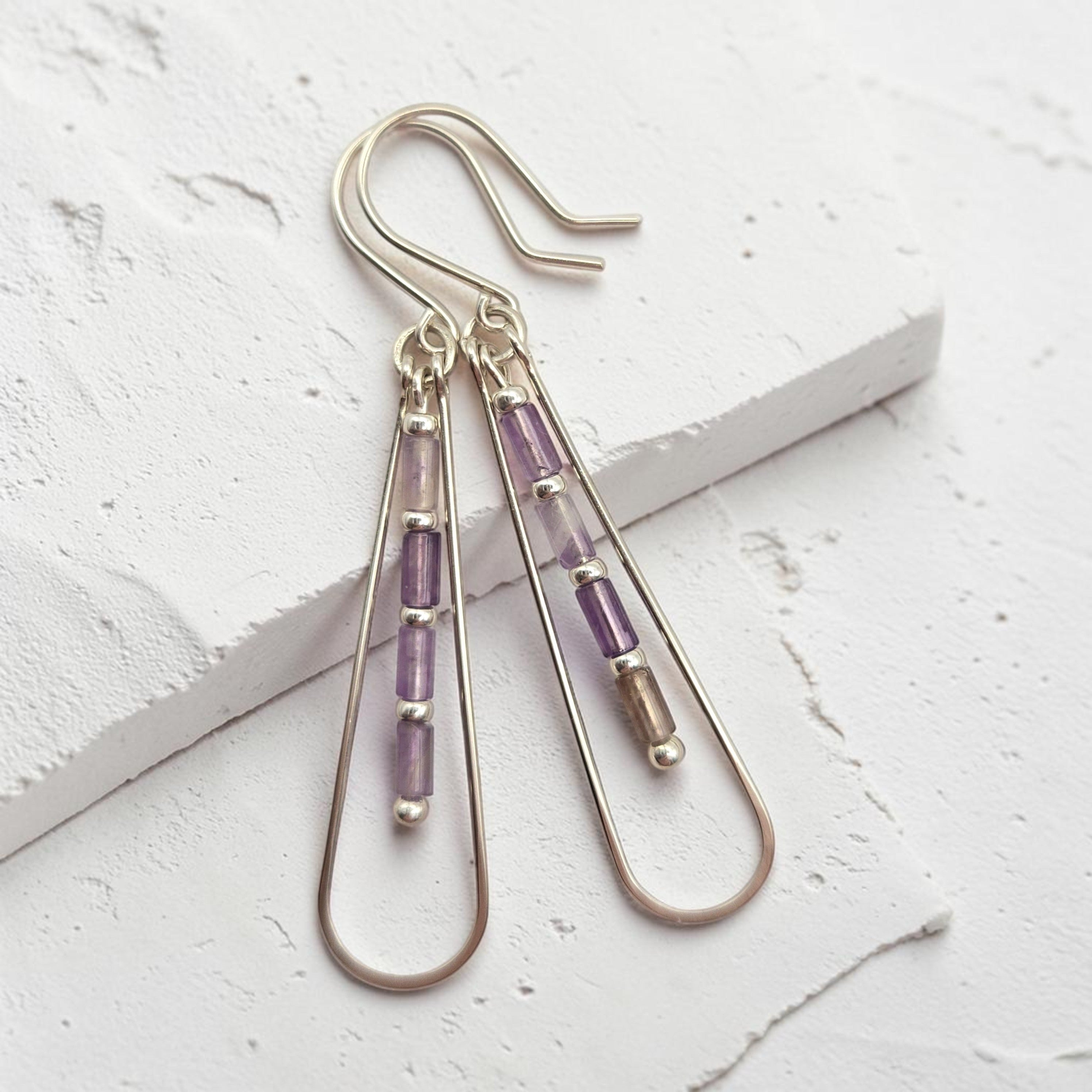 Bijou by SAM Twilight Ridge teardrop earrings with purple amethyst tube beads in sterling silver hoops.