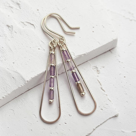 Bijou by SAM Twilight Ridge teardrop earrings with purple amethyst tube beads in sterling silver hoops.
