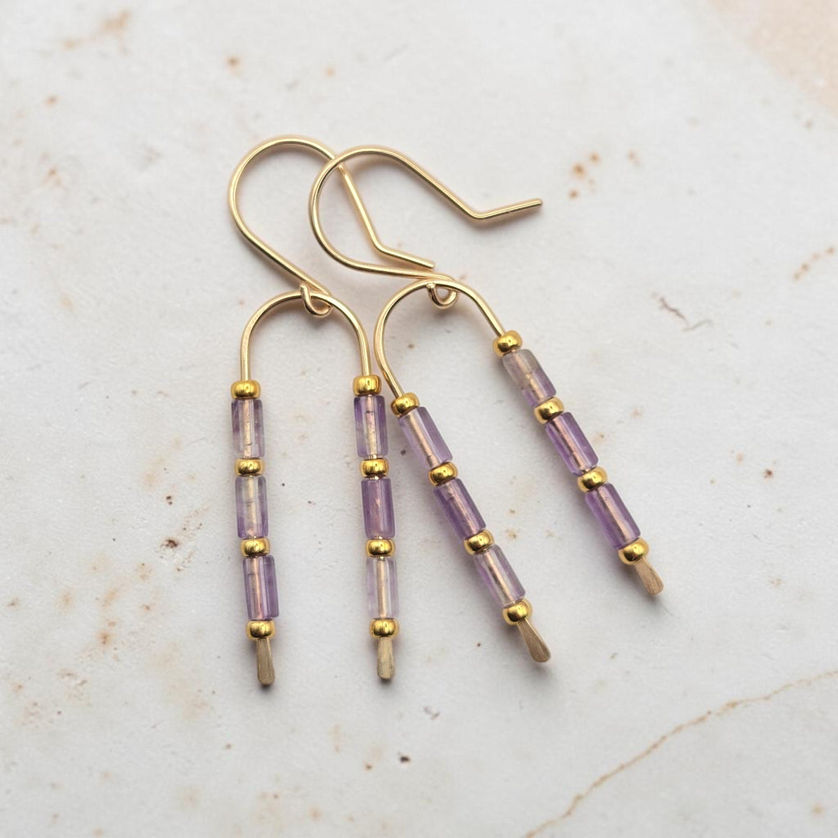 Bijou by SAM handcrafted wishbone earrings featuring purple amethyst tube stones and 14k gold fill wire