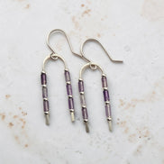 Bijou by SAM handcrafted wishbone earrings featuring purple amethyst tube stones on sterling silver wire arcs.