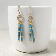 Bijou by SAM Still Water dangle earrings featuring blue apatite tube beads and 14k gold fill hoops.