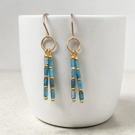 Bijou by SAM Still Water dangle earrings featuring blue apatite tube beads and 14k gold fill hoops.