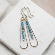 Bijou by SAM Still Water teardrop earrings featuring blue Apatite tube beads on silver hoops.