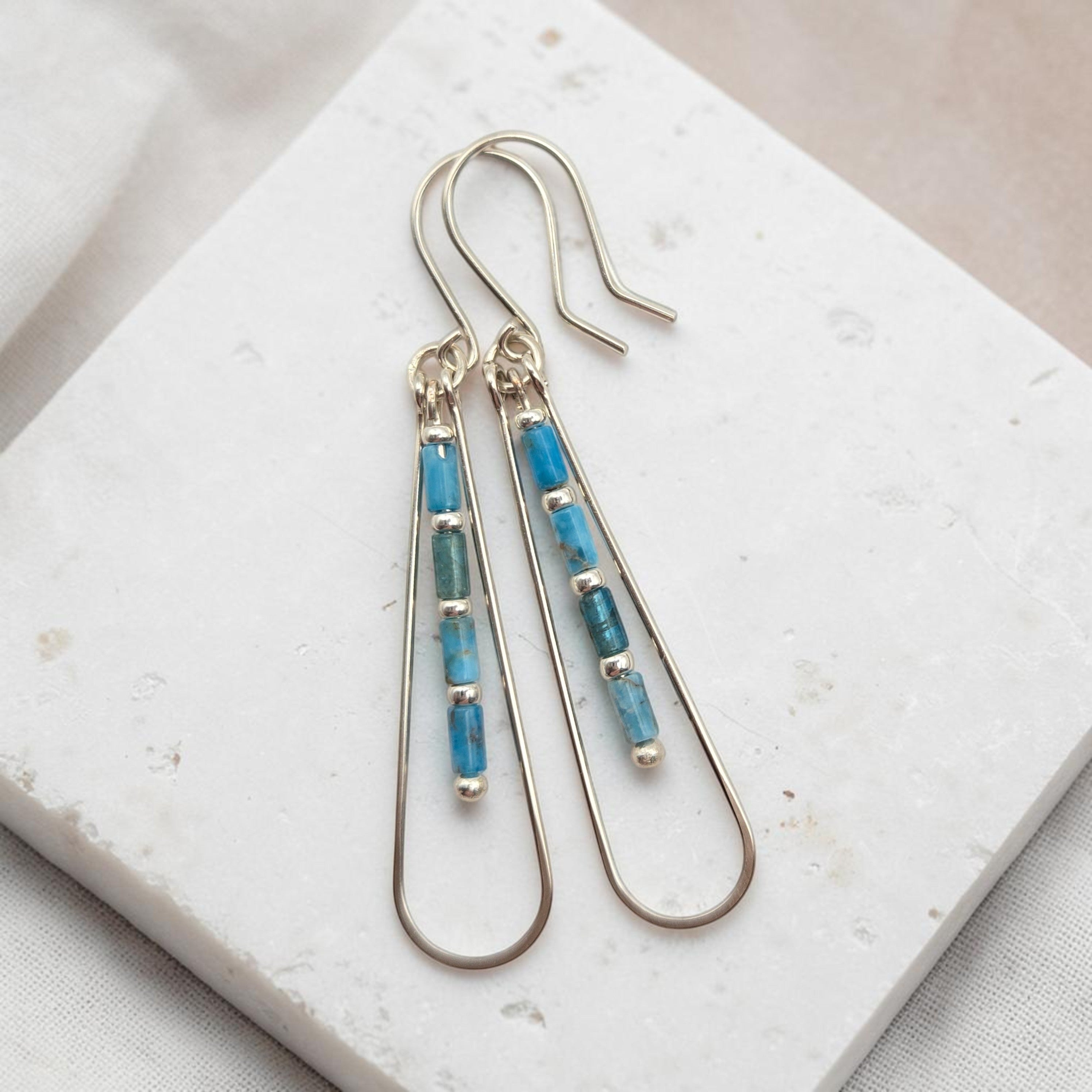 Bijou by SAM Still Water teardrop earrings featuring blue Apatite tube beads on silver hoops.