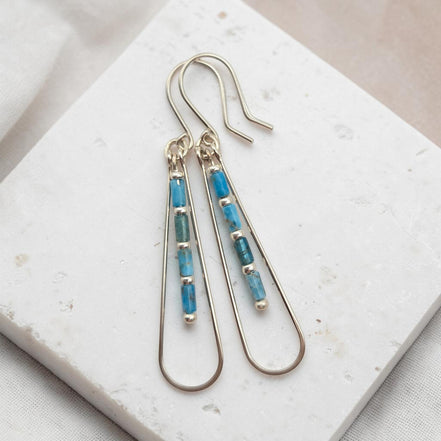 Bijou by SAM Still Water teardrop earrings featuring blue Apatite tube beads on silver hoops.