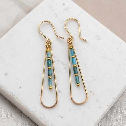 Bijou by SAM Still Water teardrop earrings featuring blue Apatite tube beads and 14k gold fill hoops on stone base.