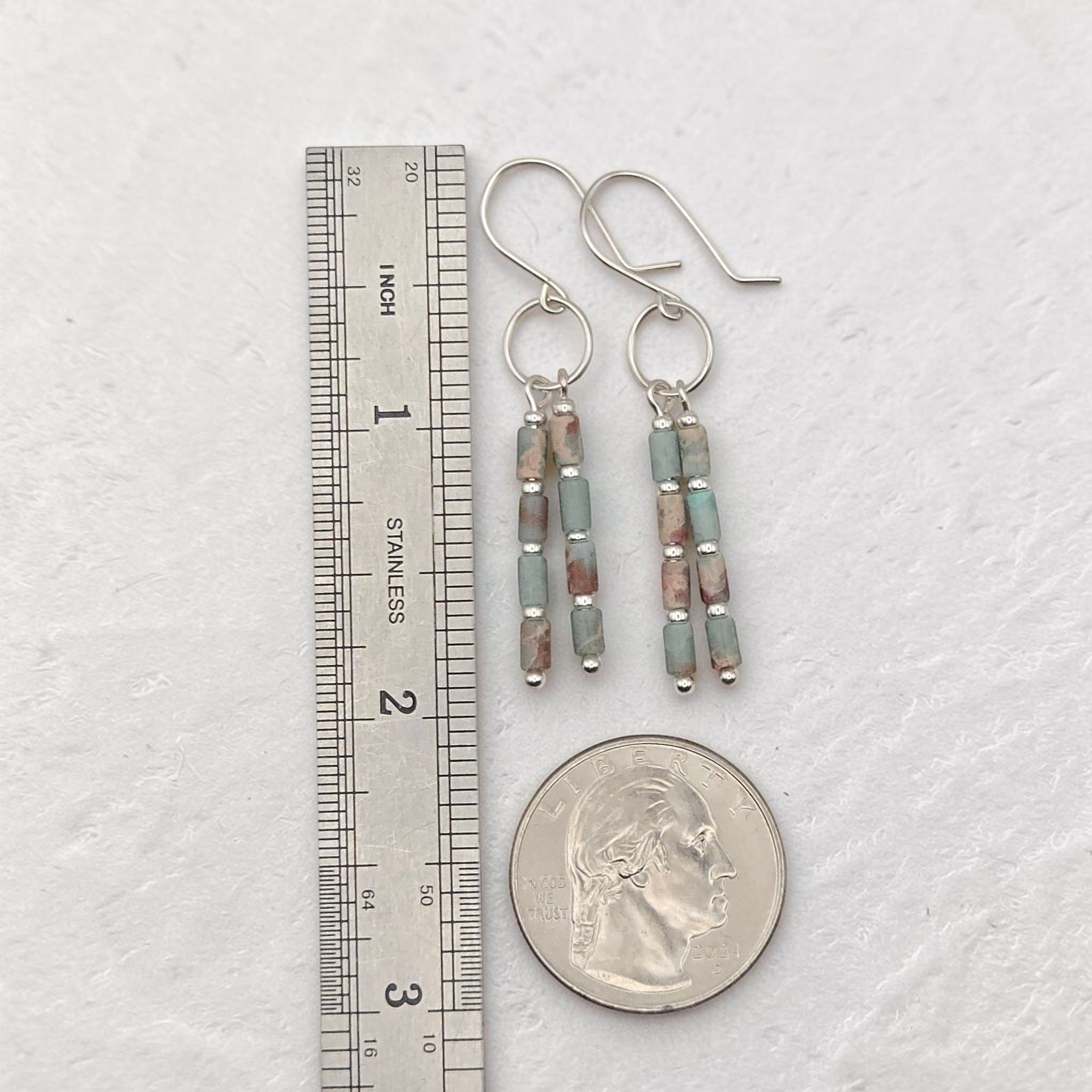 Bijou by SAM Big Sky earrings featuring Aqua Terra Jasper tube beads and sterling silver hoops next to a ruler.