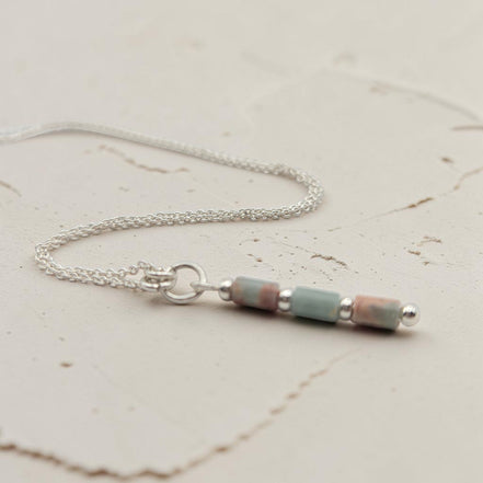 Bijou by SAM Big Sky Necklace featuring natural blue and pink Aqua Terra Jasper tube beads on a sterling silver chain.