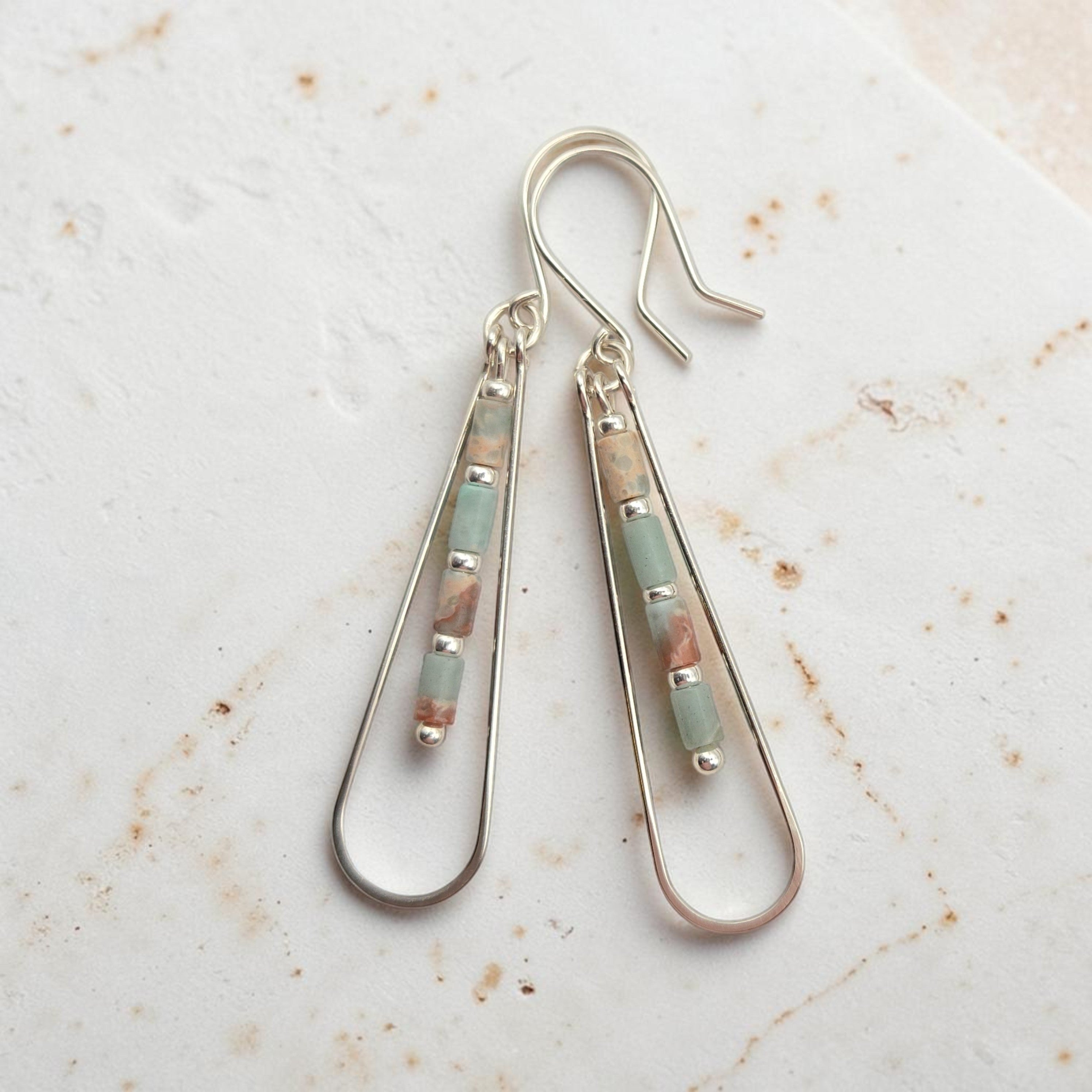 Bijou by SAM Open Sky teardrop earrings featuring aqua terra jasper tube beads in sterling silver hoops.