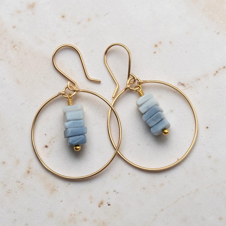Bijou by SAM handmade gold hoop earrings featuring a delicate stack of square-cut denim blue opal stones.