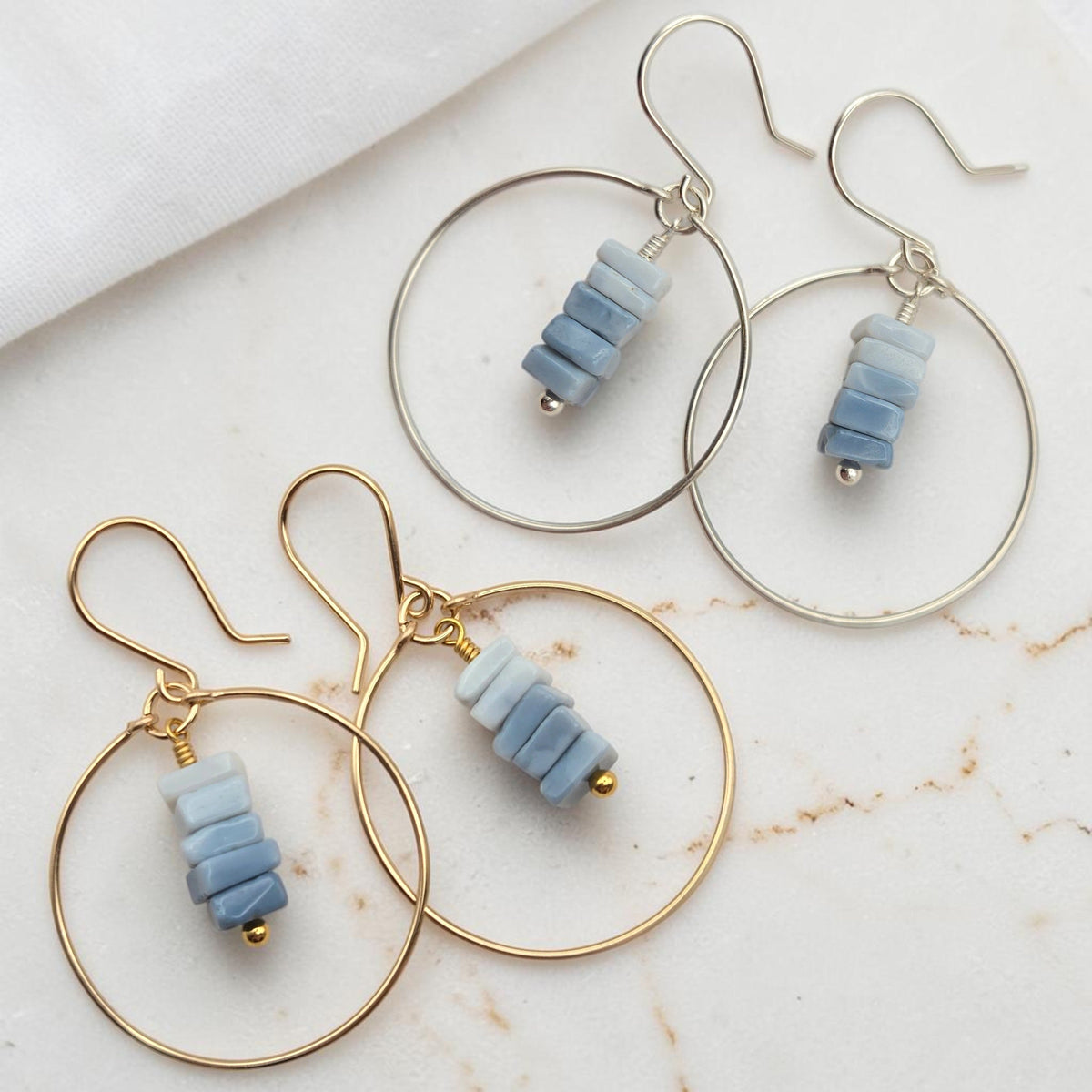 Bijou by SAM handmade hoop earrings featuring square-cut denim blue opal stones in gold fill and sterling silver.
