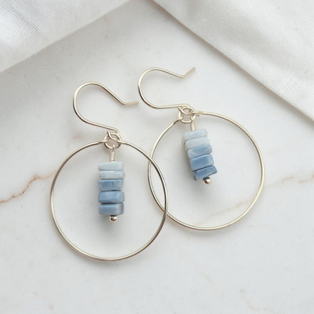 Bijou by SAM handmade hoop earrings featuring a delicate stack of square-cut denim blue opal stones on gold wire.