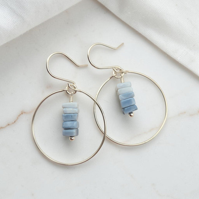 Bijou by SAM handmade hoop earrings featuring a delicate stack of square-cut denim blue opal stones on gold wire.