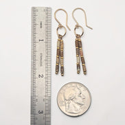 Bijou by SAM Canyon Earrings featuring natural Picture Jasper tube beads and gold fill hoops on a white background.