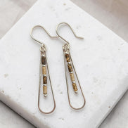 Bijou by SAM Canyon Teardrop Hoops featuring picture jasper tube beads and sterling silver dangles on a stone base.