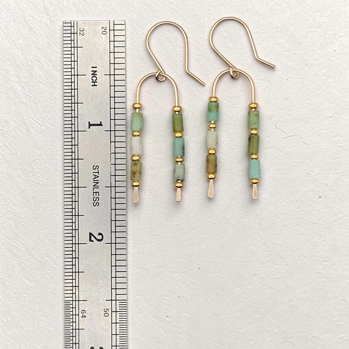 Bijou by SAM handcrafted wishbone earrings featuring green Chrysoprase tube stones on 14k gold fill wire with ruler.