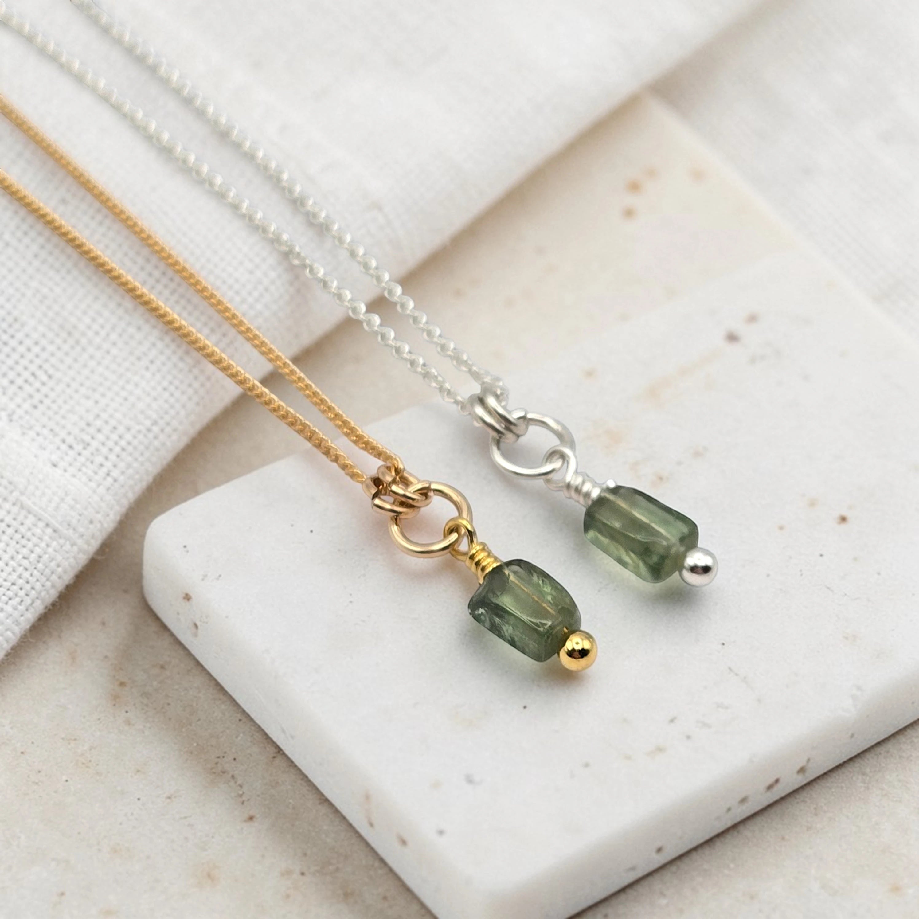 Bijou by SAM Eos necklaces featuring handcut green apatite gemstones on delicate gold fill and sterling silver chains.