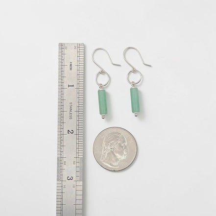 Bijou by SAM Ava earrings featuring cylinder-shaped green aventurine stones on sterling silver hoops for scale.