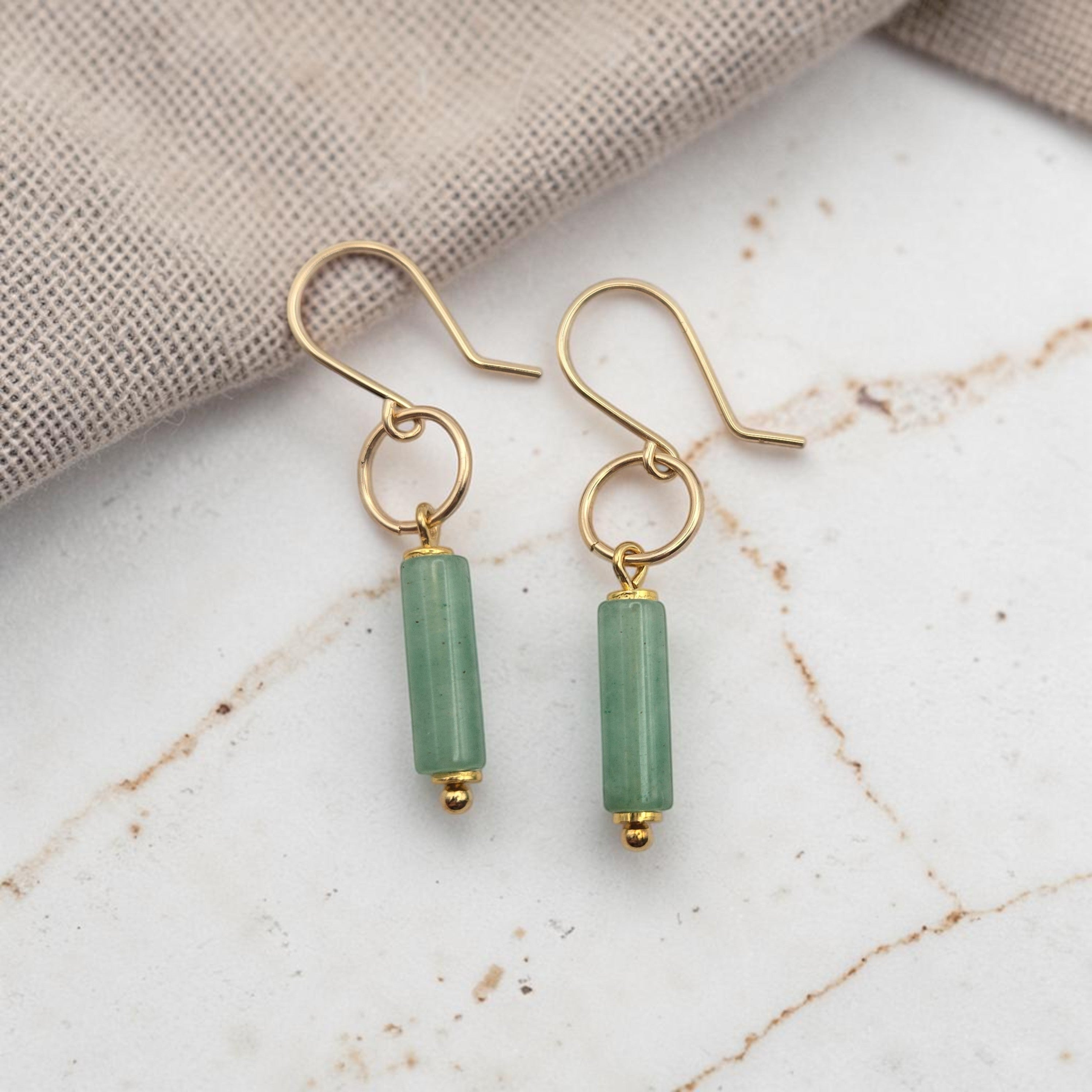 Bijou by SAM Ava earrings featuring cylindrical green aventurine gemstones hanging from 14k gold fill hoops.