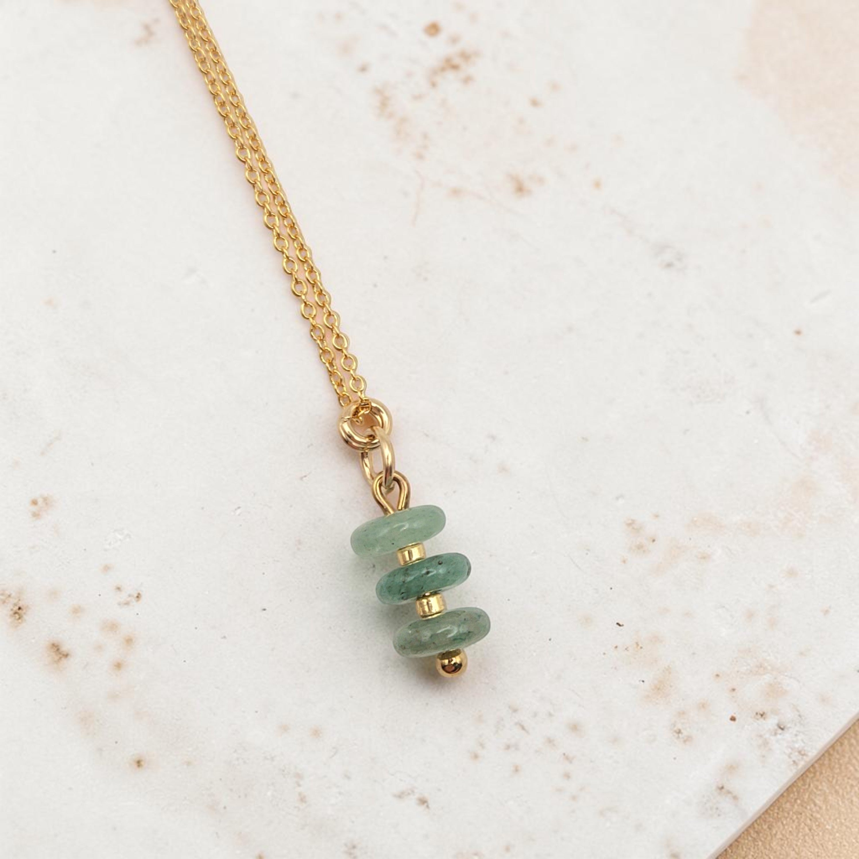 Bijou by SAM Comet necklace featuring three small green aventurine disc stones on a delicate gold chain