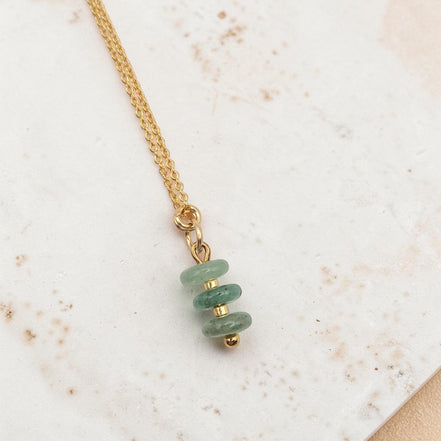 Bijou by SAM Comet necklace featuring three small green aventurine disc stones on a delicate gold chain