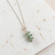 Bijou by SAM Comet necklace featuring three stacked green aventurine stones on a delicate sterling silver chain.