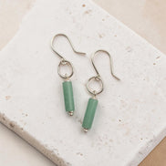 Bijou by SAM Ava earrings featuring cylindrical green aventurine stones suspended from sterling silver hoops.