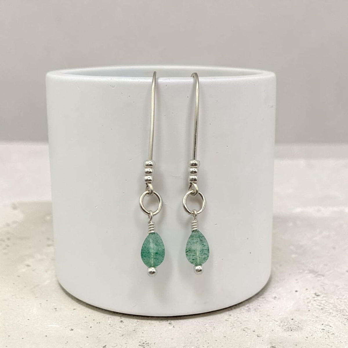 Bijou by SAM teardrop green aventurine threader earrings with sterling silver wire and polished gemstone accents.