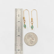 Bijou by SAM teardrop green aventurine threader earrings in 14k gold fill shown with a ruler and quarter for scale.