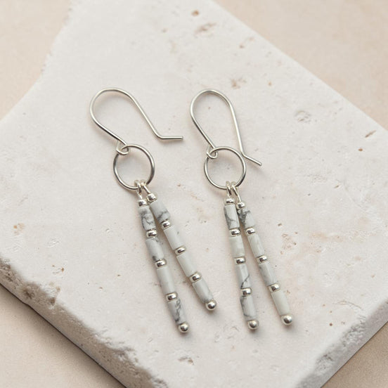 Bijou by SAM First Snow dangle earrings featuring white Howlite tube beads and Argentium Sterling Silver hoops.