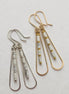 Bijou by SAM First Snow teardrop hoop earrings with white Howlite beads in gold fill and sterling silver.
