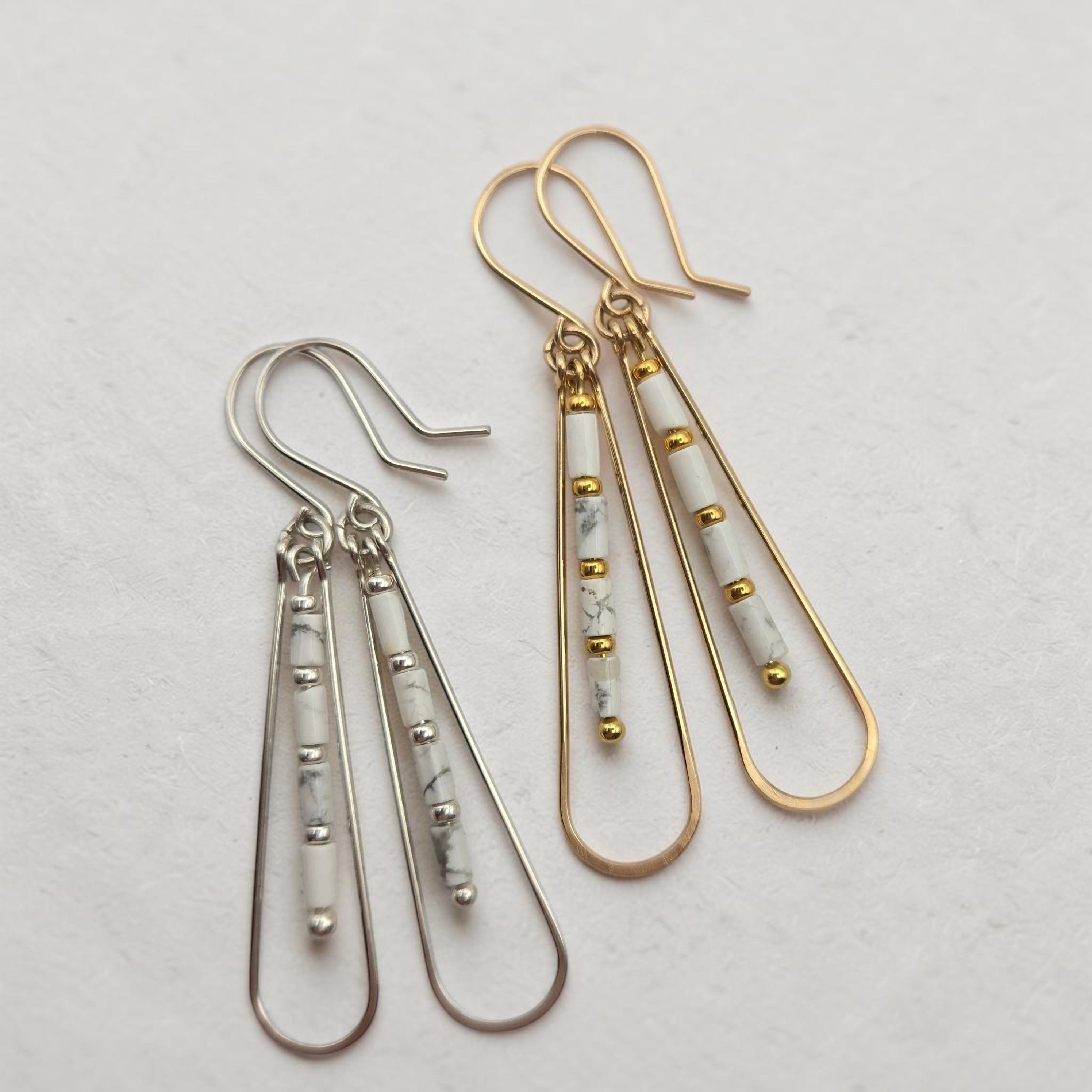 Bijou by SAM First Snow teardrop hoop earrings with white Howlite beads in gold fill and sterling silver.