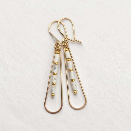 Bijou by SAM First Snow teardrop hoop earrings featuring white Howlite tube beads and 14k gold fill wire.