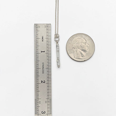 Bijou by SAM First Snow necklace featuring a natural white howlite tube bead on a delicate sterling silver chain.