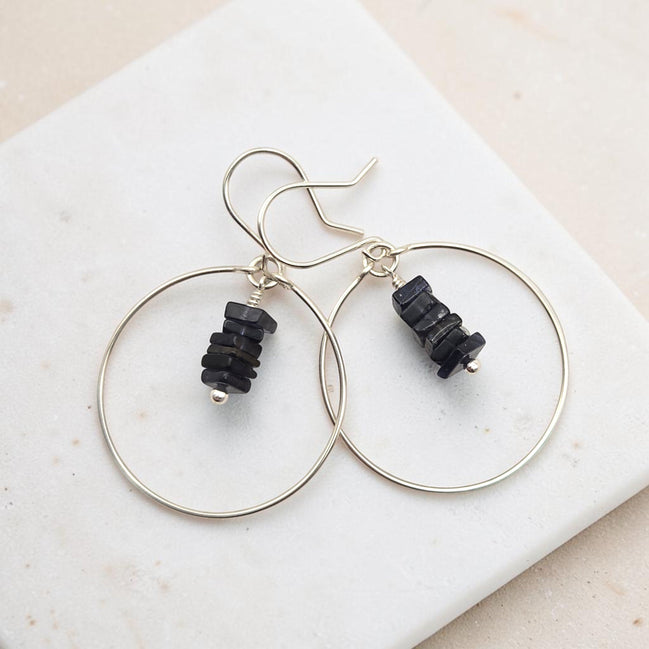 Bijou by SAM handmade hoop earrings featuring a delicate stack of square-cut deep blue iolite gemstones in silver.