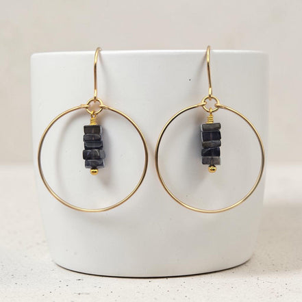 Bijou by SAM handmade gold hoop earrings featuring a delicate stack of deep blue square-cut iolite gemstones